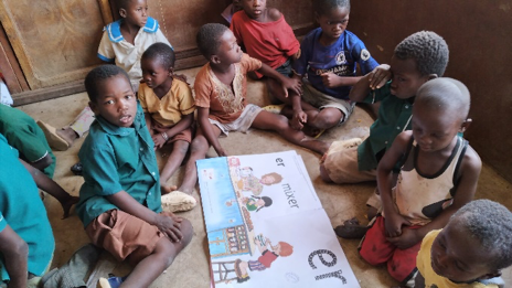 Children working on floor without desks